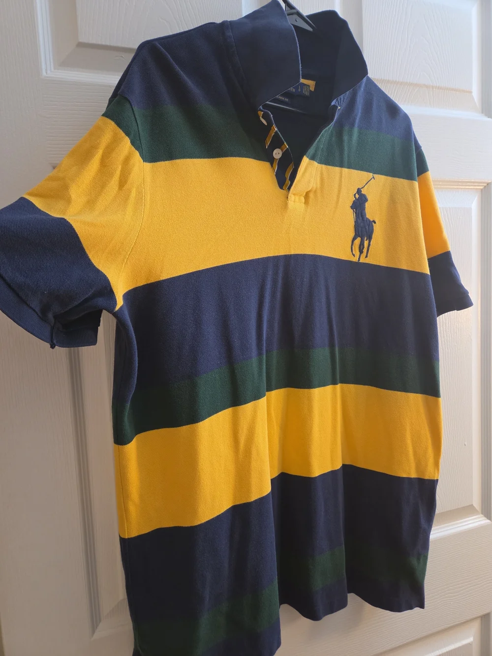 A Polo Ralph Lauren navy, yellow, and green striped short-sleeve.